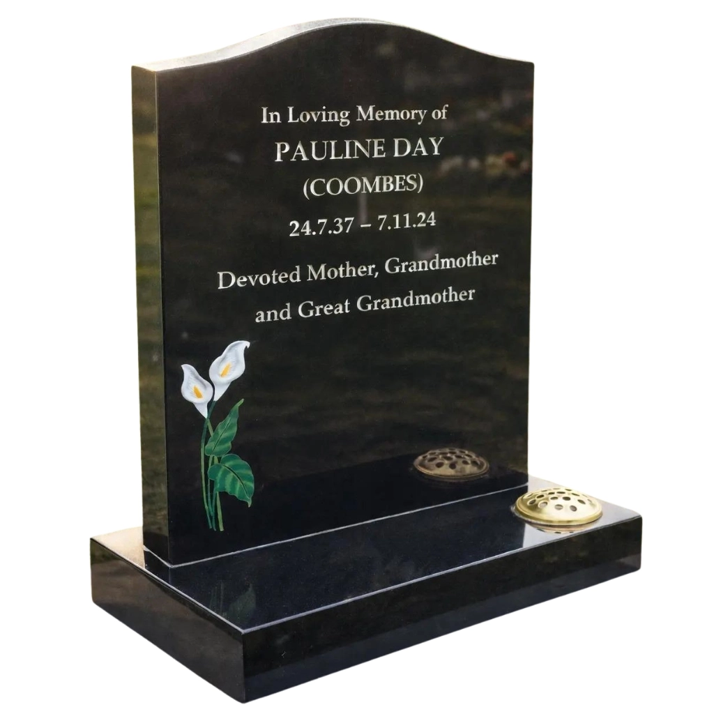 Black granite headstone with lily design – The Madonna by Churchill Memorials