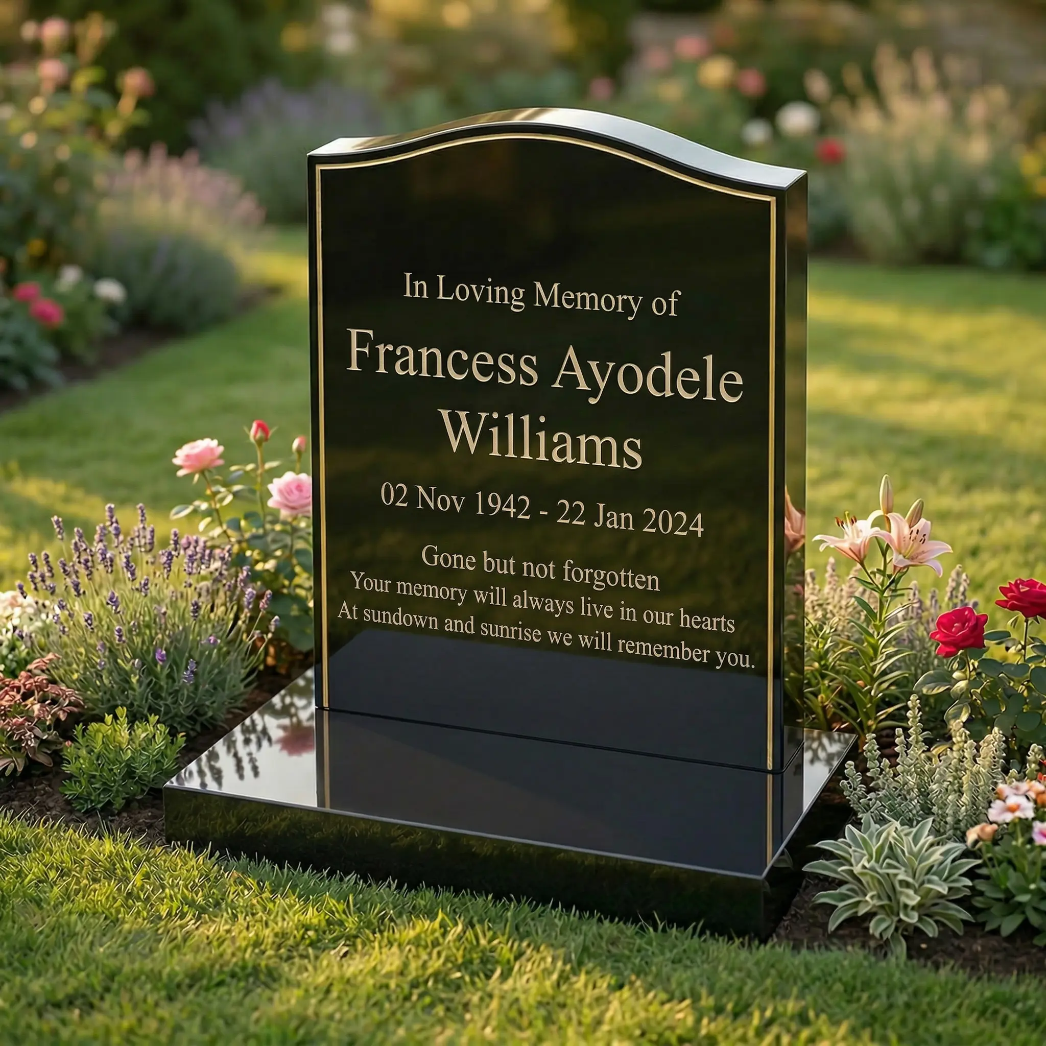 Black granite headstone with gold pinline detail and polished finish